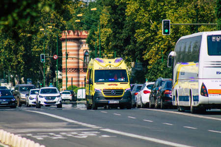 Seville Spain September 28, 2021 Ambulance driving through the streets of Seville during the coronavirus outbreak hitting Spain, wearing a mask is mandatoryのeditorial素材