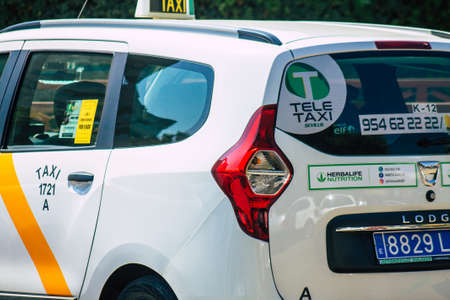 Seville Spain September 28, 2021 Taxi driving through the streets of Seville during the coronavirus...