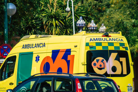 Seville Spain September 28, 2021 Ambulance driving through the streets of Seville during the coronavirus outbreak hitting Spain, wearing a mask is mandatoryのeditorial素材
