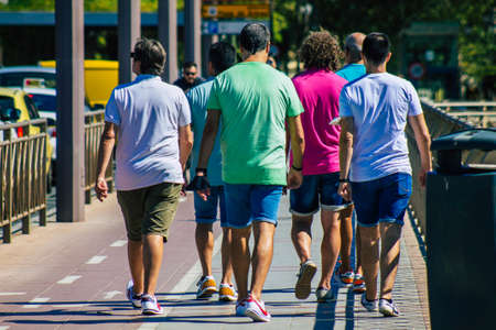Seville Spain September 18, 2021 Pedestrians walking in the street during the coronavirus outbreak hitting Spain, wearing a mask is not mandatory but most of people wear itのeditorial素材