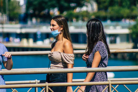 Seville Spain September 18, 2021 Pedestrians walking in the street during the coronavirus outbreak hitting Spain, wearing a mask is not mandatory but most of people wear itのeditorial素材