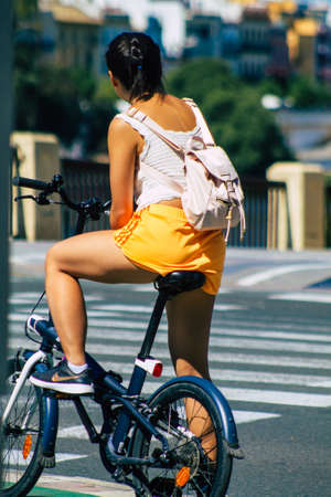 Seville Spain September 18, 2021 People rolling with a bicycle in the streets of Seville, an emblematic city and the capital of the region of Andalusia, in the south of Spainのeditorial素材
