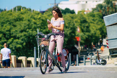 Seville Spain September 18, 2021 People rolling with a bicycle in the streets of Seville, an emblematic city and the capital of the region of Andalusia, in the south of Spainのeditorial素材