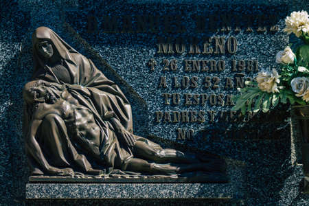 Seville Spain September 21, 2021 Typical graves in a Christian cemetery of the municipality of Carmona in Andalusia in southern Spain, the graves are made in the depth of a wall and richly decoratedのeditorial素材
