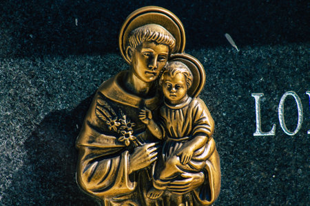 Seville Spain September 21, 2021 Typical graves in a Christian cemetery of the municipality of Carmona in Andalusia in southern Spain, the graves are made in the depth of a wall and richly decoratedのeditorial素材