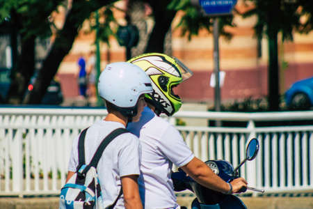 Seville Spain September 22, 2021 People rolling with a motorcycle in the streets of Seville, an emblematic city and the capital of the region of Andalusia, in the south of Spainのeditorial素材