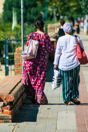 Seville Spain September 22, 2021 Pedestrians walking in the street during the coronavirus outbreak hitting Spain, wearing a mask is not mandatory but most people wear itのeditorial素材