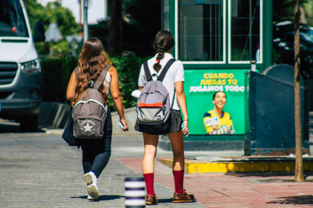 Seville Spain September 22, 2021 School girl walking in the street during the coronavirus outbreak hitting Spain, wearing a mask is not mandatory but most people wear itのeditorial素材