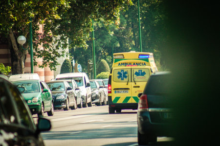 Seville Spain September 28, 2021 Ambulance driving through the streets of Seville during the coronavirus outbreak hitting Spain, wearing a mask is mandatoryのeditorial素材