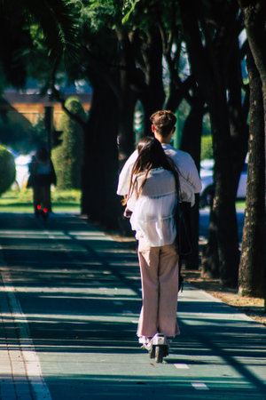 Seville Spain September 28, 2021 People rolling with an electric scooter in the streets of Seville, operating with a small utility internal combustion engines and a deck in the centerのeditorial素材