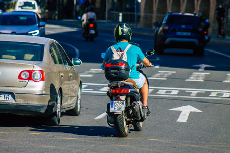 Seville Spain September 18, 2021 People rolling with a motorcycle in the streets of Seville, an emblematic city and the capital of the region of Andalusia, in the south of Spainのeditorial素材