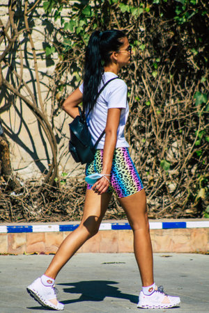 Seville Spain September 22, 2021 Unidentified woman walking in the street during the coronavirus outbreak hitting Spain, wearing a mask is not mandatory but most people wear itのeditorial素材
