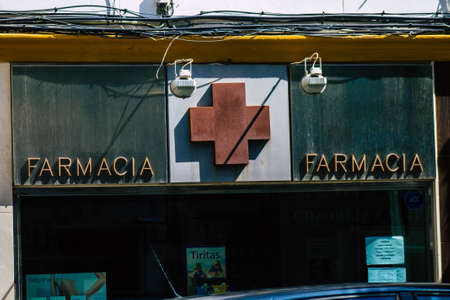 Seville Spain September 18, 2021 Commercial sign front a business located in Seville, an emblematic city and the capital of the region of Andalusia, in the south of Spainのeditorial素材
