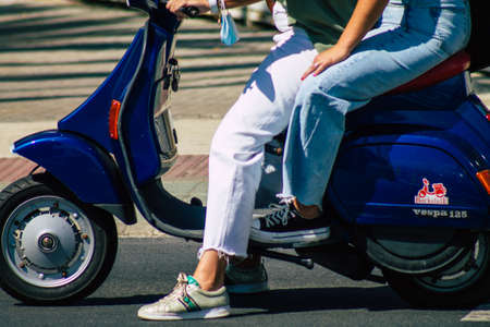 Seville Spain September 22, 2021 People rolling with a motorcycle in the streets of Seville, an emblematic city and the capital of the region of Andalusia, in the south of Spainのeditorial素材