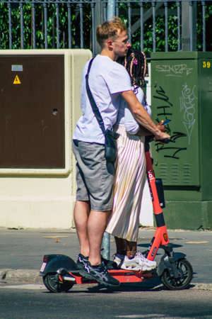 Seville Spain September 22, 2021 People rolling with an electric scooter in the streets of Seville,...