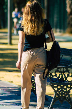 Seville Spain September 22, 2021 Unidentified woman walking in the street during the coronavirus outbreak hitting Spain, wearing a mask is not mandatory but most people wear itのeditorial素材