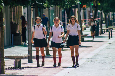 Seville Spain September 22, 2021 School girl walking in the street during the coronavirus outbreak...