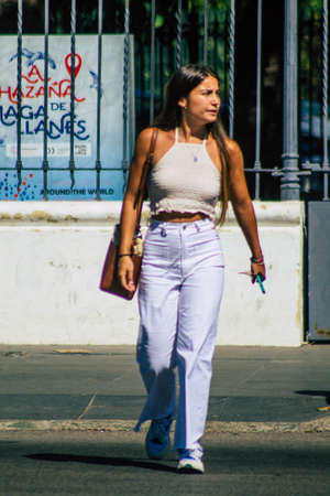 Seville Spain September 22, 2021 Unidentified woman walking in the street during the coronavirus outbreak hitting Spain, wearing a mask is not mandatory but most people wear itのeditorial素材