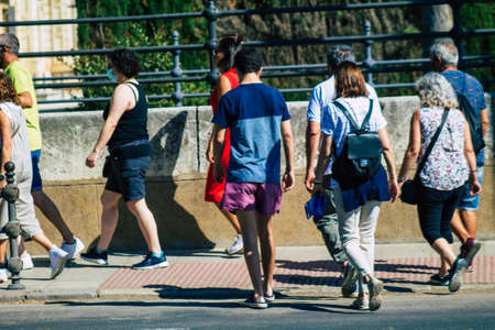Seville Spain September 22, 2021 Pedestrians walking in the street during the coronavirus outbreak hitting Spain, wearing a mask is not mandatory but most people wear itのeditorial素材