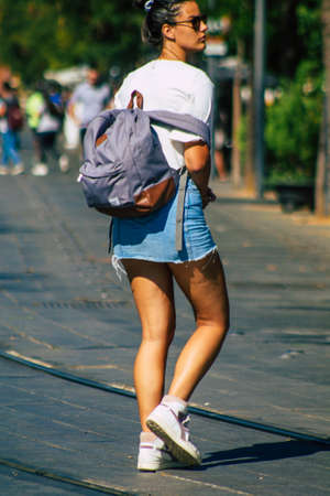 Seville Spain September 22, 2021 Unidentified woman walking in the street during the coronavirus outbreak hitting Spain, wearing a mask is not mandatory but most people wear itのeditorial素材