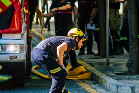 Seville Spain September 22, 2021 Seville firefighters training at the fire station during the coronavirus outbreak, they are training in the use of firefighting equipment under intervention conditionsのeditorial素材