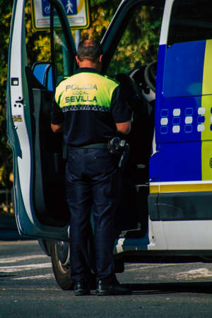 Seville Spain September 22, 2021 Police officer in the streets of Seville during the coronavirus outbreak hitting Spain, wearing a mask in the street is not mandatoryのeditorial素材