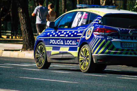 Seville Spain September 22, 2021 Police car patrolling in the streets of Seville during the coronavirus outbreak hitting Spain, wearing a mask in the street is not mandatoryのeditorial素材