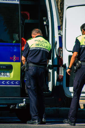 Seville Spain September 22, 2021 Police officer in the streets of Seville during the coronavirus outbreak hitting Spain, wearing a mask in the street is not mandatoryのeditorial素材
