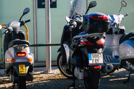 Seville Spain September 22, 2021 Motorcycle parked in the streets of Seville, an emblematic city and the capital of the region of Andalusiaのeditorial素材