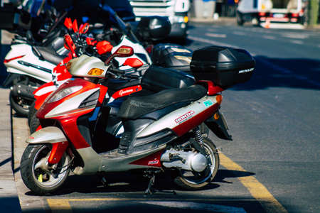 Seville Spain September 22, 2021 Motorcycle parked in the streets of Seville, an emblematic city and the capital of the region of Andalusiaのeditorial素材