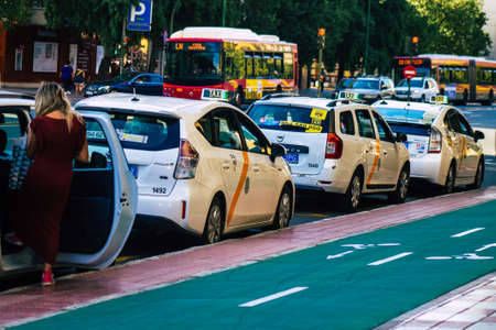 Seville Spain September 22, 2021 Taxi driving through the streets of Seville during the coronavirus outbreak hitting Spain, wearing a mask is mandatoryのeditorial素材
