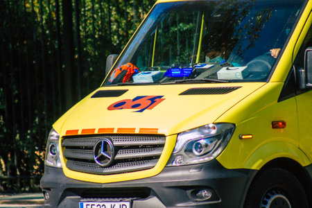 Seville Spain September 22, 2021 Ambulance driving through the streets of Seville during the coronavirus outbreak hitting Spain, wearing a mask is mandatoryのeditorial素材