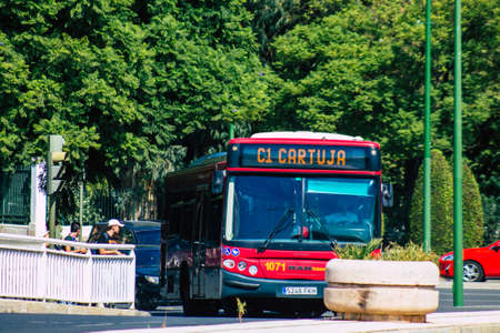 Seville Spain September 22, 2021 Bus driving through the streets of Seville during the coronavirus outbreak hitting Spain, wearing a mask is mandatoryのeditorial素材