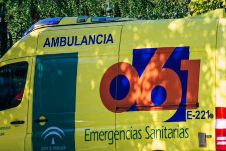 Seville Spain September 22, 2021 Ambulance driving through the streets of Seville during the coronavirus outbreak hitting Spain, wearing a mask is mandatoryのeditorial素材