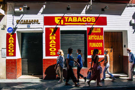 Seville Spain September 18, 2021 Pedestrians walking in the street during the coronavirus outbreak hitting Spain, wearing a mask is not mandatory but most of people wear itのeditorial素材