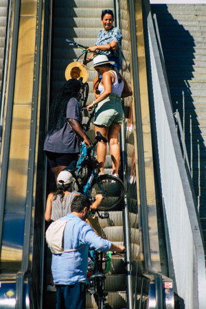 Seville Spain September 18, 2021 Pedestrians using an escalator during the coronavirus outbreak...