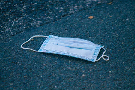Seville Spain September 18, 2021 Surgical mask to protect against the coronavirus thrown in the streets of Seville during the coronavirus pandemic affecting Spainのeditorial素材