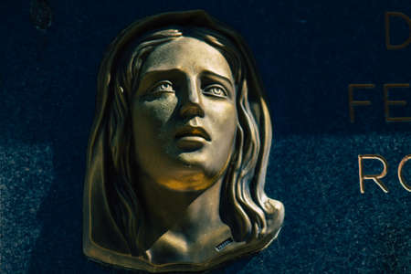 Seville Spain September 21, 2021 Typical graves in a Christian cemetery of the municipality of Carmona in Andalusia in southern Spain, the graves are made in the depth of a wall and richly decoratedのeditorial素材