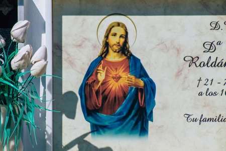 Seville Spain September 21, 2021 Typical graves in a Christian cemetery of the municipality of Carmona in Andalusia in southern Spain, the graves are made in the depth of a wall and richly decoratedのeditorial素材