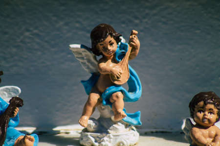 Seville Spain September 21, 2021 Typical graves in a Christian cemetery of the municipality of Carmona in Andalusia in southern Spain, the graves are made in the depth of a wall and richly decoratedのeditorial素材