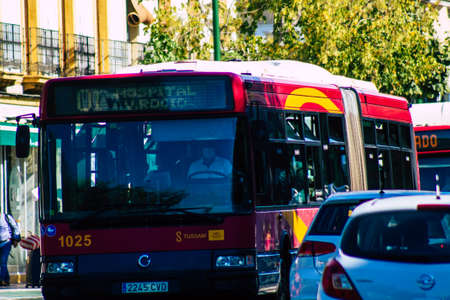 Seville Spain September 22, 2021 Bus driving through the streets of Seville during the coronavirus outbreak hitting Spain, wearing a mask is mandatoryのeditorial素材