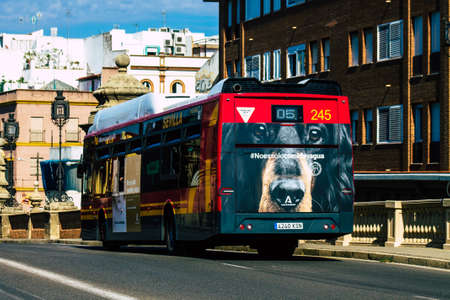 Seville Spain September 22, 2021 Bus driving through the streets of Seville during the coronavirus outbreak hitting Spain, wearing a mask is mandatoryのeditorial素材