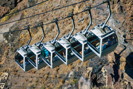 Santorini Island, Fira, Greece - October 08, 2021 Cable car provides a safe transport from the old port to Fira. Tourists also use it just to admire the amazing view of the stunning calderaのeditorial素材