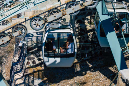 Santorini Island, Fira, Greece - October 08, 2021 Cable car provides a safe transport from the old port to Fira. Tourists also use it just to admire the amazing view of the stunning calderaのeditorial素材