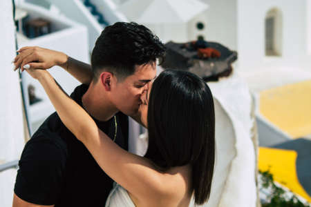 Santorini, Oia, Greece - October 24, 2021 Crowd of tourists visiting the famous perched town of Oia during the coronavirus epidemic hitting Greece, wearing a mask in the street is not mandatoryのeditorial素材