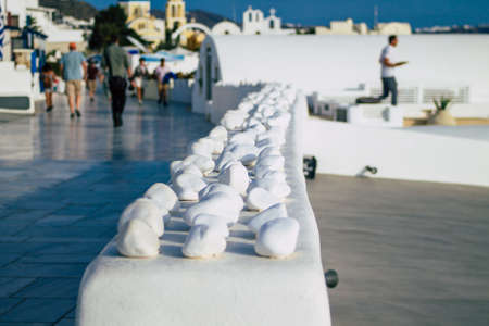 Santorini, Oia, Greece - October 24, 2021 Crowd of tourists visiting the famous perched town of Oia...