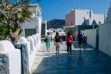 Santorini, Oia, Greece - October 24, 2021 Crowd of tourists visiting the famous perched town of Oia during the coronavirus epidemic hitting Greece, wearing a mask in the street is not mandatoryのeditorial素材