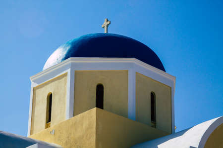 Santorini, Oia, Greece - October 24, 2021 Traditional orthodox church located in the town of Oia front the sea, typical of this island are perched on the side of the ancient active volcanoのeditorial素材