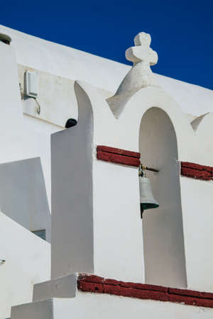 Santorini, Oia, Greece - October 24, 2021 Traditional orthodox church located in the town of Oia front the sea, typical of this island are perched on the side of the ancient active volcanoのeditorial素材