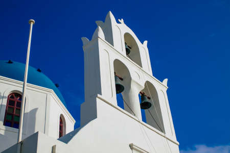 Santorini, Oia, Greece - October 24, 2021 Traditional orthodox church located in the town of Oia front the sea, typical of this island are perched on the side of the ancient active volcanoのeditorial素材